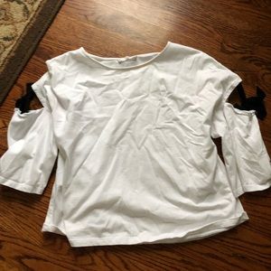 White top with black ties